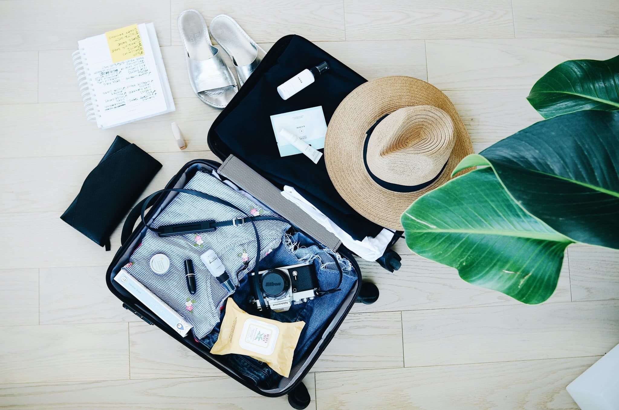 Reisevorbereitung Kofferpacken mit Checkliste